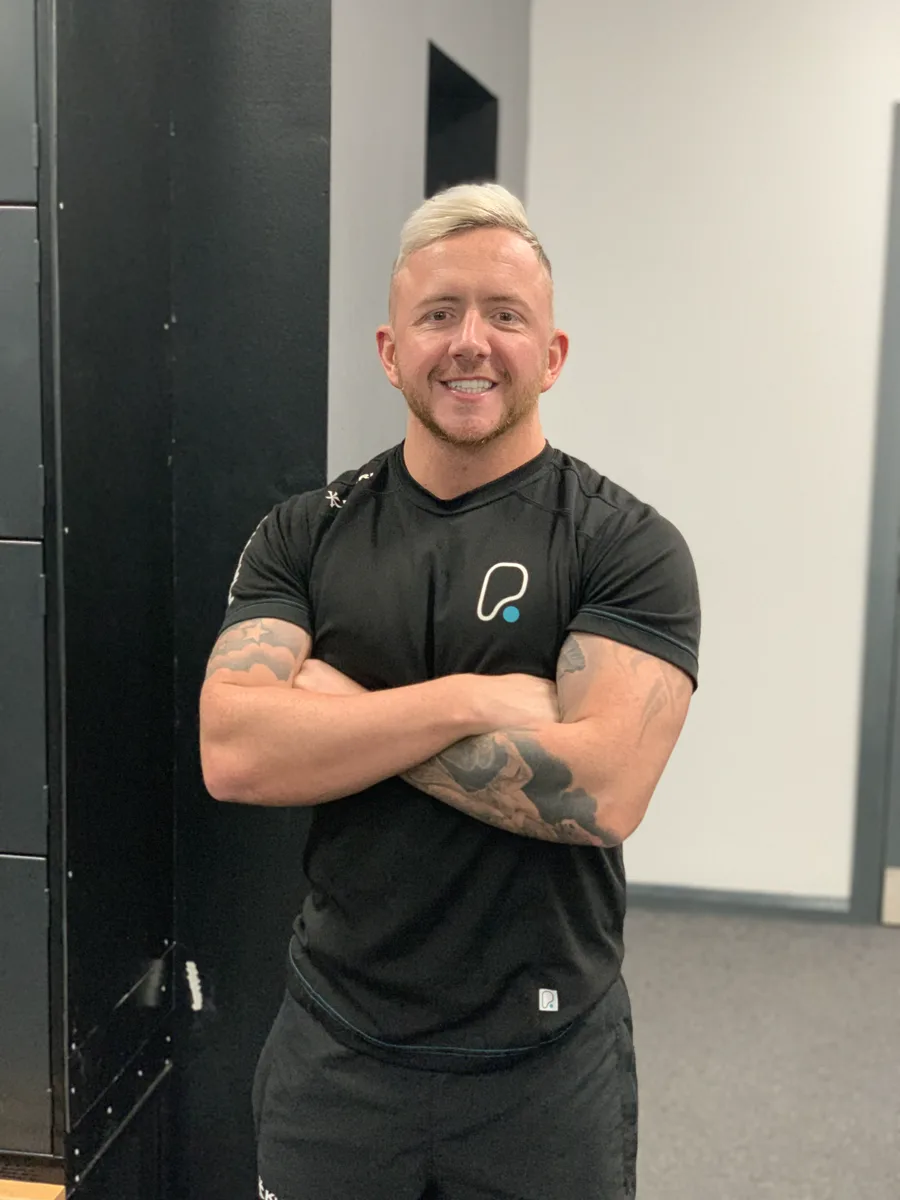 Chris Bradley in his personal trainer days, on the gym floor at PureGym.